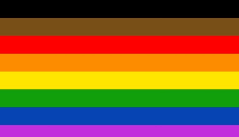 The original rainbow pride flag with black and brown bars added to the top